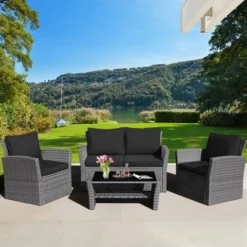 Tangkula 4-Piece Patio Rattan Conversation Set with Black Cushions & Coffee Table