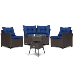 Tangkula 4-Piece Rattan Outdoor Furniture Set with Navy Cushions & Coffee Table